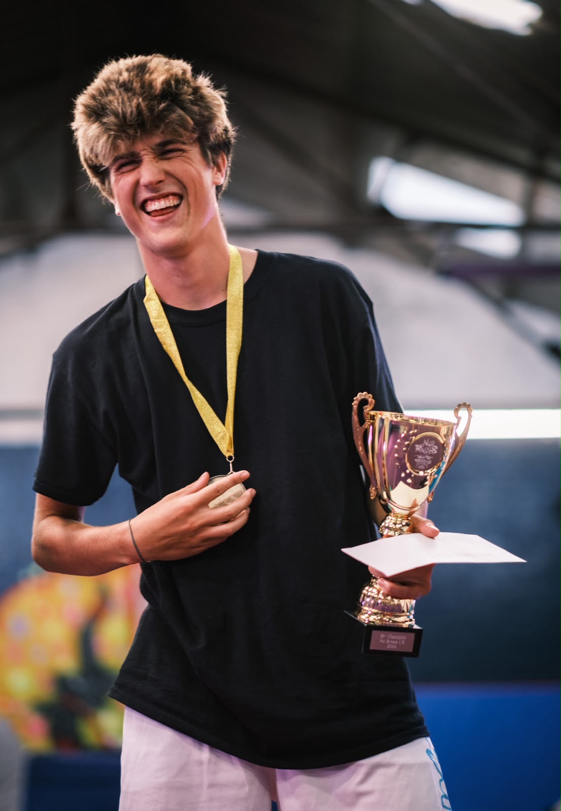 Bowie Brennan of the WightTricks Pro Team with a championship trophy